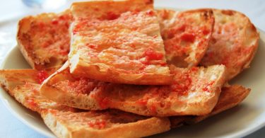 pan tumaca on a plate