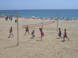 Playing volleyball on the beach in Barcelona