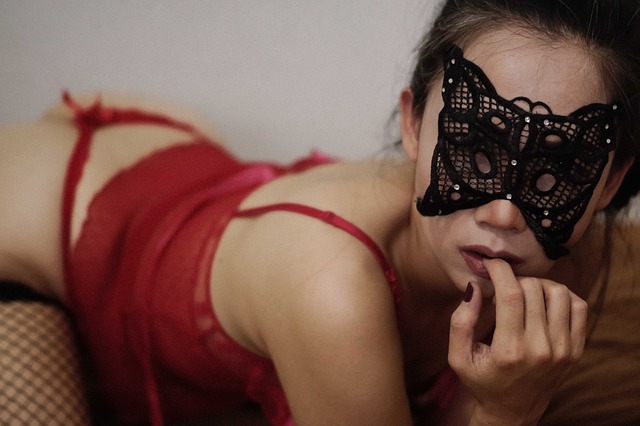 lady in red lingerie and black mask