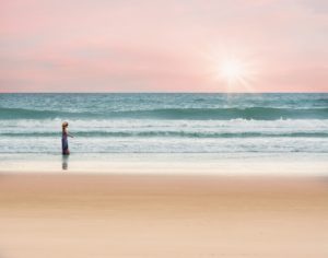 girl on beach with sunset