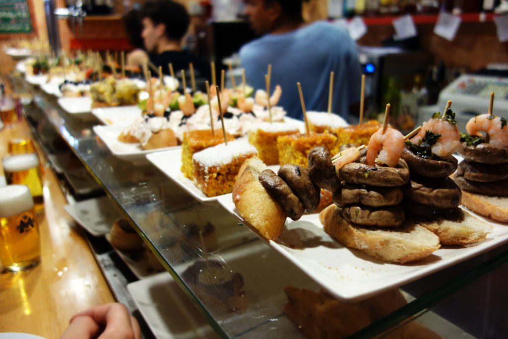 plates of pintxos and tapas along the bar 