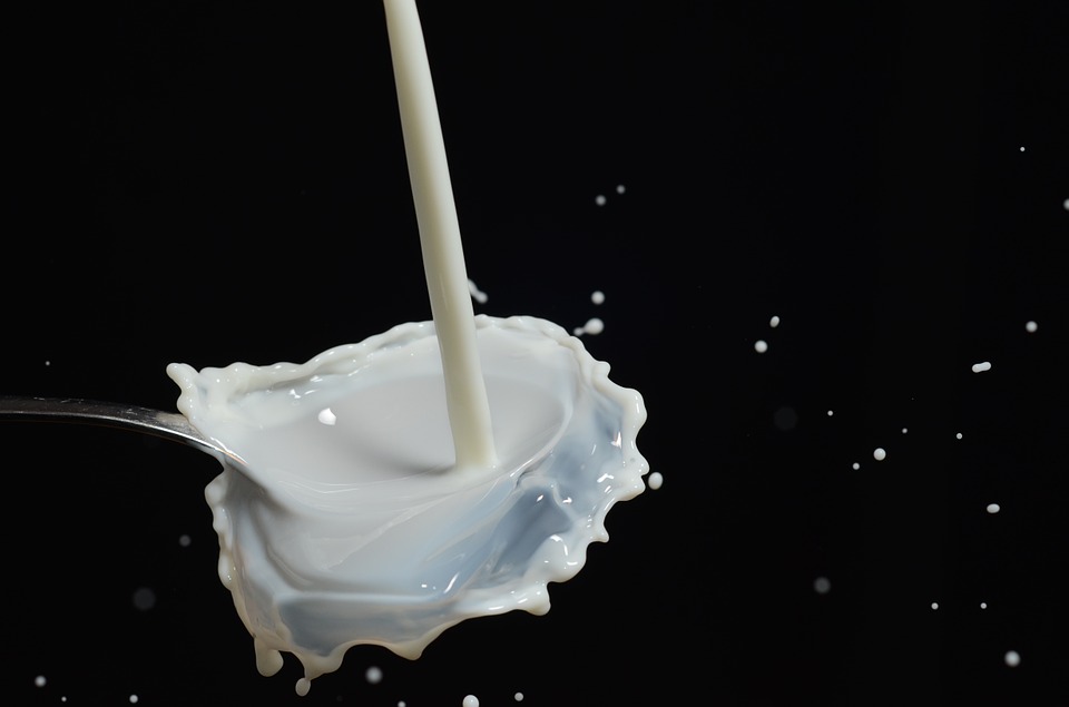 milk splashes on spoon