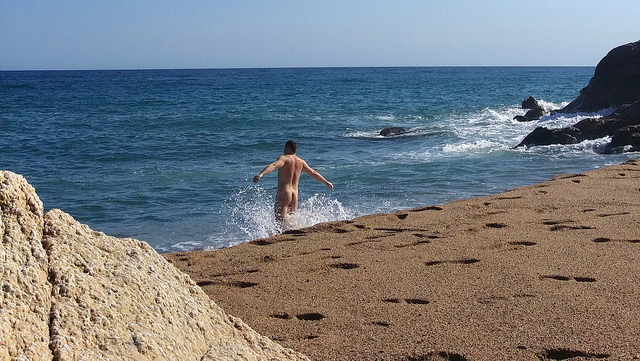 man on nudist beach in barcelona