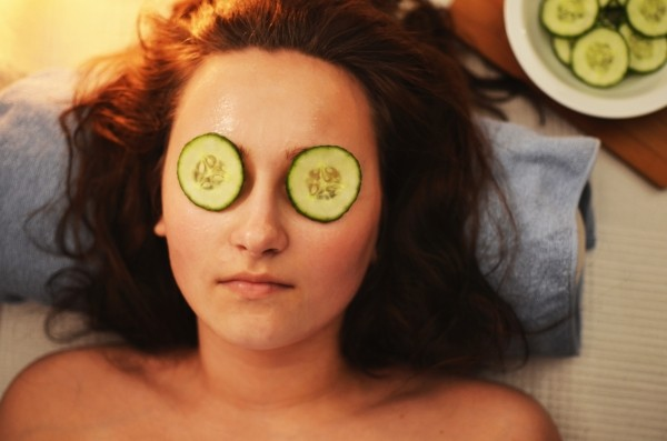 lady with cucumber on eyes