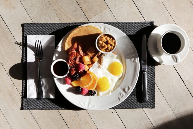 plate with breakfast outside in sun