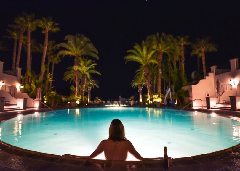 lady in pool by night