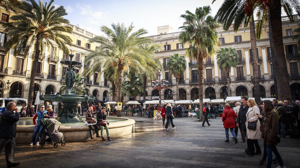 square in barcelona with palm trees