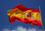 spanish flag with blue skies