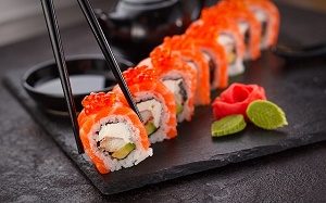 colourful sushi on a black plate