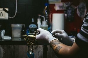 tattoo artist preparing