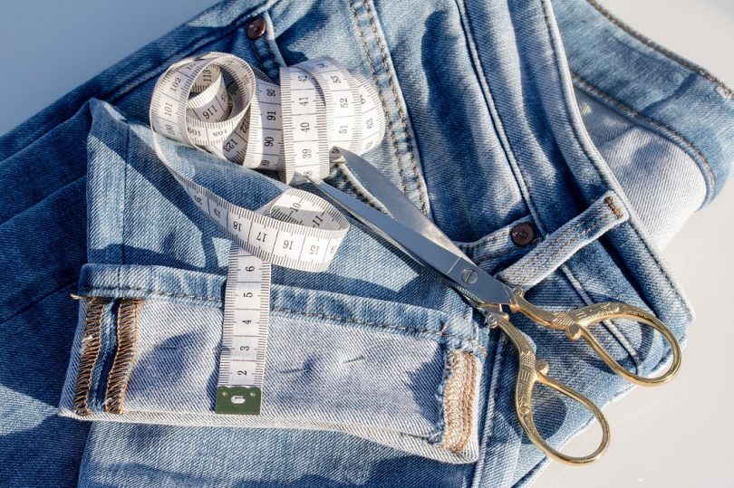 jeans, scissors and measure tape