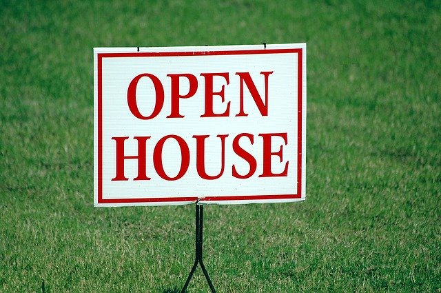 open house sign on lawn