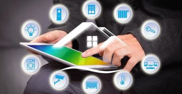 man on tablet with icons domotics