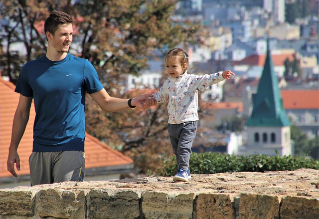 father and child walking