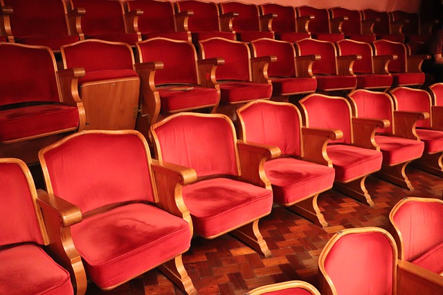 red velvet chairs in theatre