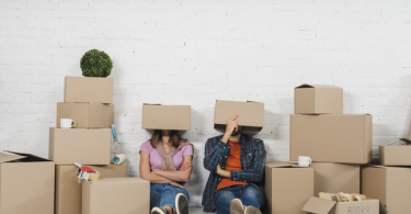 couple with moving boxes