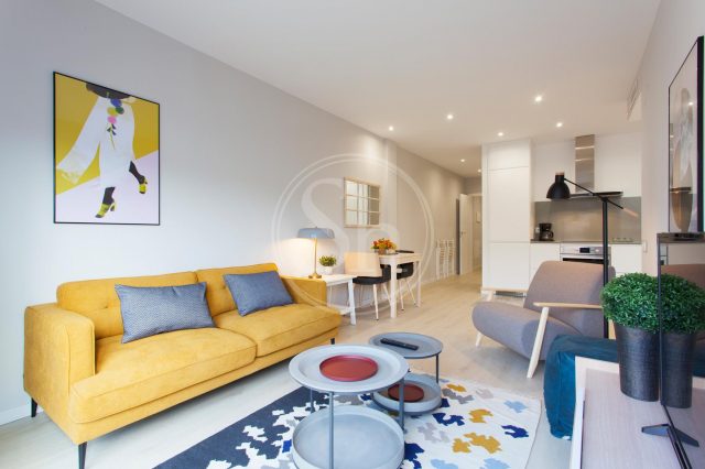 student apartments in barcelona with yellow couch