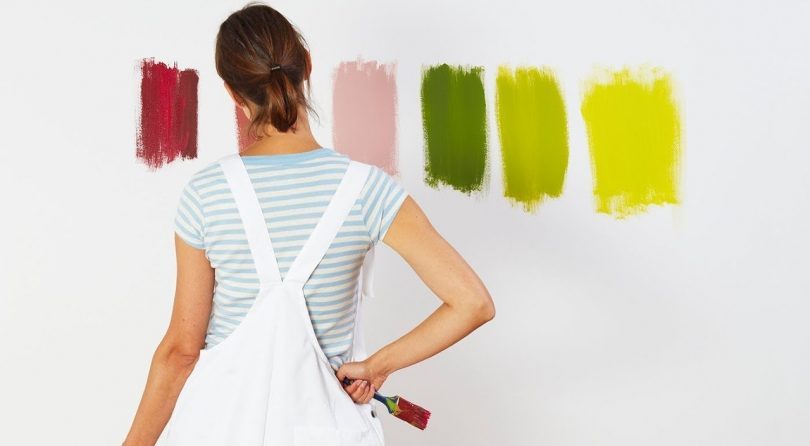 lady with 6 test colours on the wall