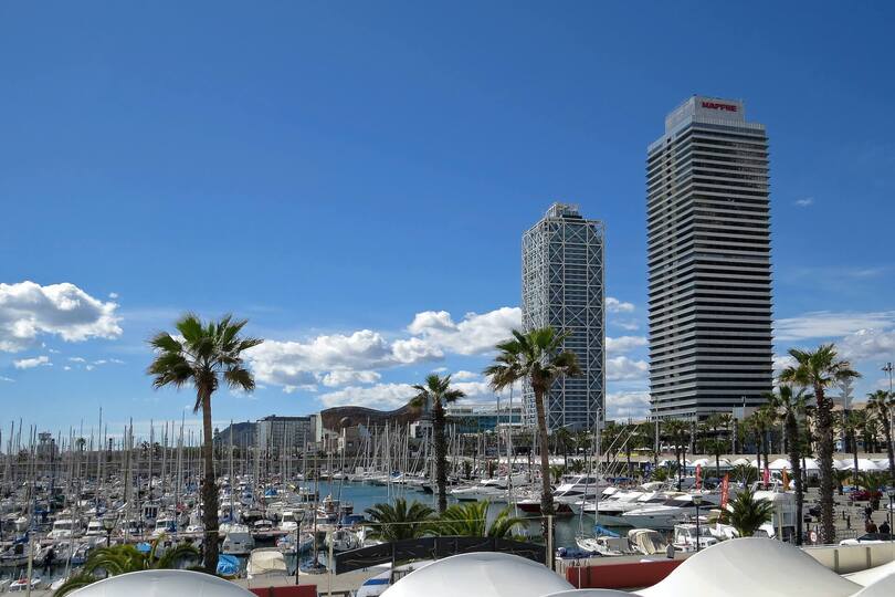 mapfre towers and beach barceloneta - one of the best places in barcelona to invest in property