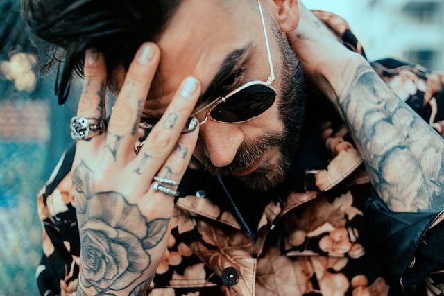 man with beard glasses and tattoos