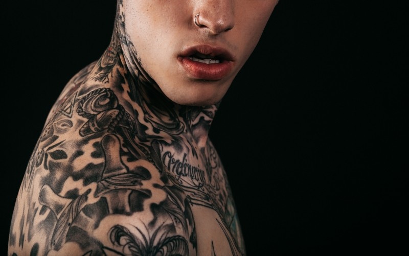 tattoo on upper body and neck