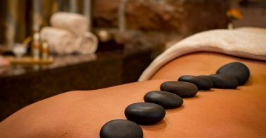 lady with hot stones on back