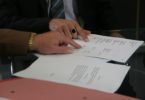 two people looking at contract