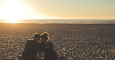 couple on beach at sunset