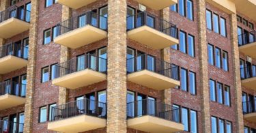 exterior apartment building with yellow balconies