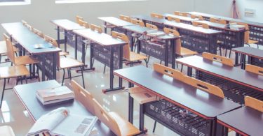 classroom filled with tables and chairs