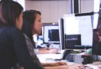 students sitting at computer doing project