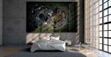 modern bedroom with lots of concrete and art on wall