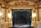 interior old theatre with blue curtains