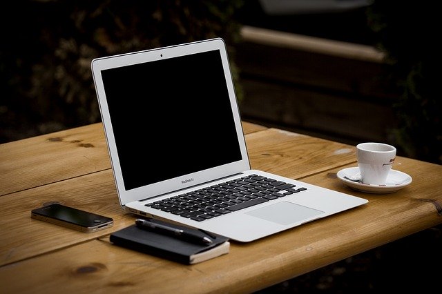 laptop on wooden table