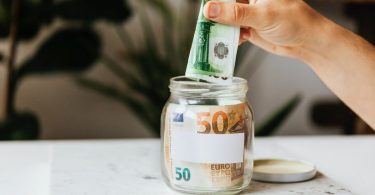 saving money in a glass jar