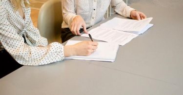 two ladies discussing rental property contract template