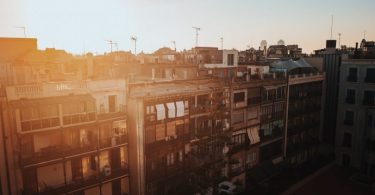 apartments with sun behind them