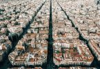 Aerial photo of Barcelona's Eixample district, with its typical blocks of buildings.